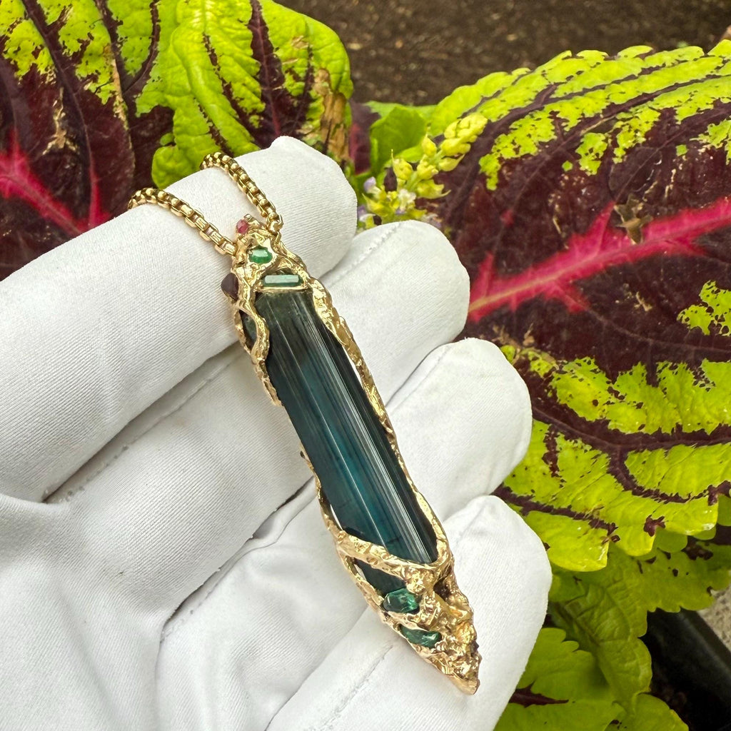 A one-of-a-kind masterpiece crafted from 14k gold, featuring an old stock, Indicolite Pederneira Tourmaline.