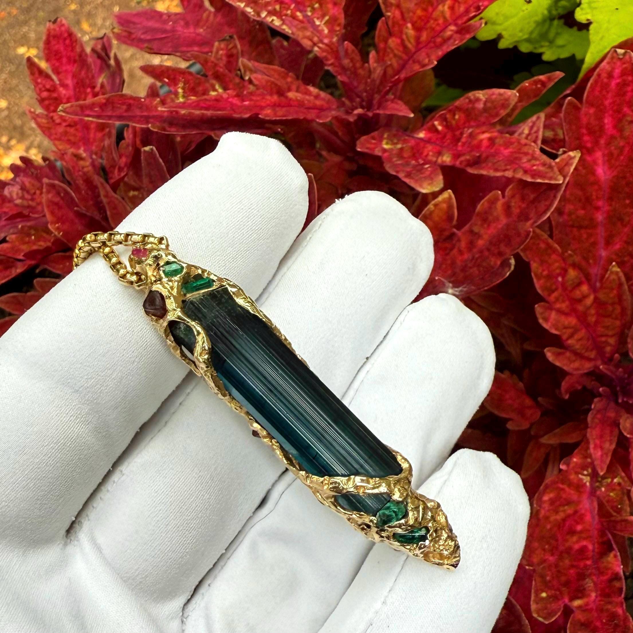 A one-of-a-kind masterpiece crafted from 14k gold, featuring an old stock, Indicolite Pederneira Tourmaline.