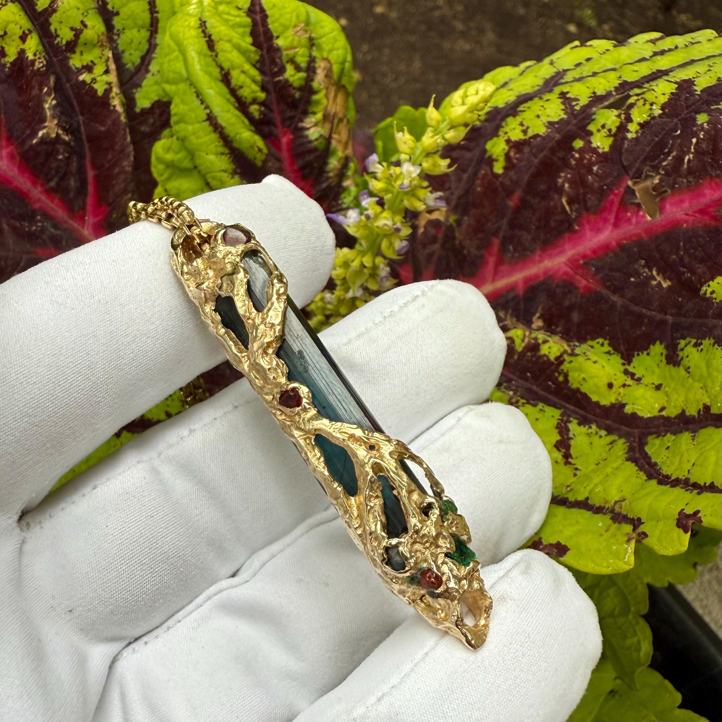 A one-of-a-kind masterpiece crafted from 14k gold, featuring an old stock, Indicolite Pederneira Tourmaline.