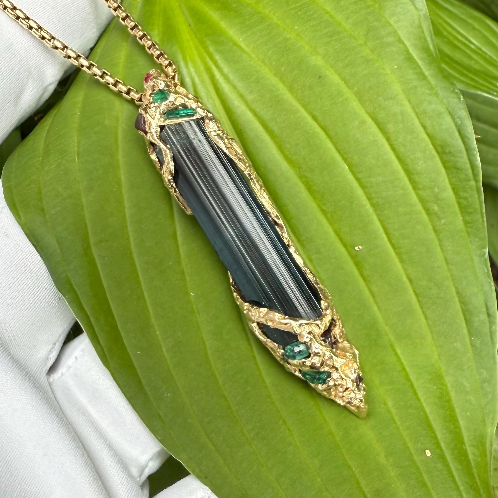 A one-of-a-kind masterpiece crafted from 14k gold, featuring an old stock, Indicolite Pederneira Tourmaline.
