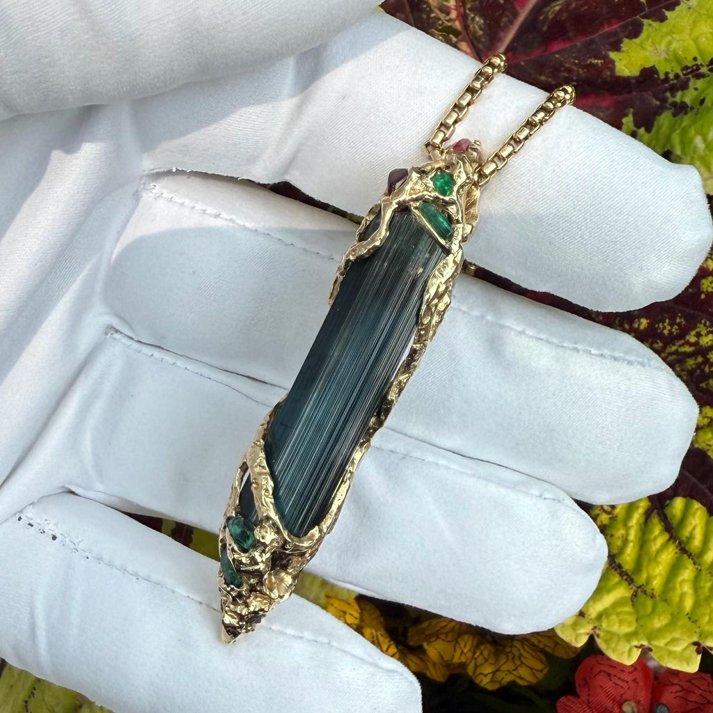 A one-of-a-kind masterpiece crafted from 14k gold, featuring an old stock, Indicolite Pederneira Tourmaline.