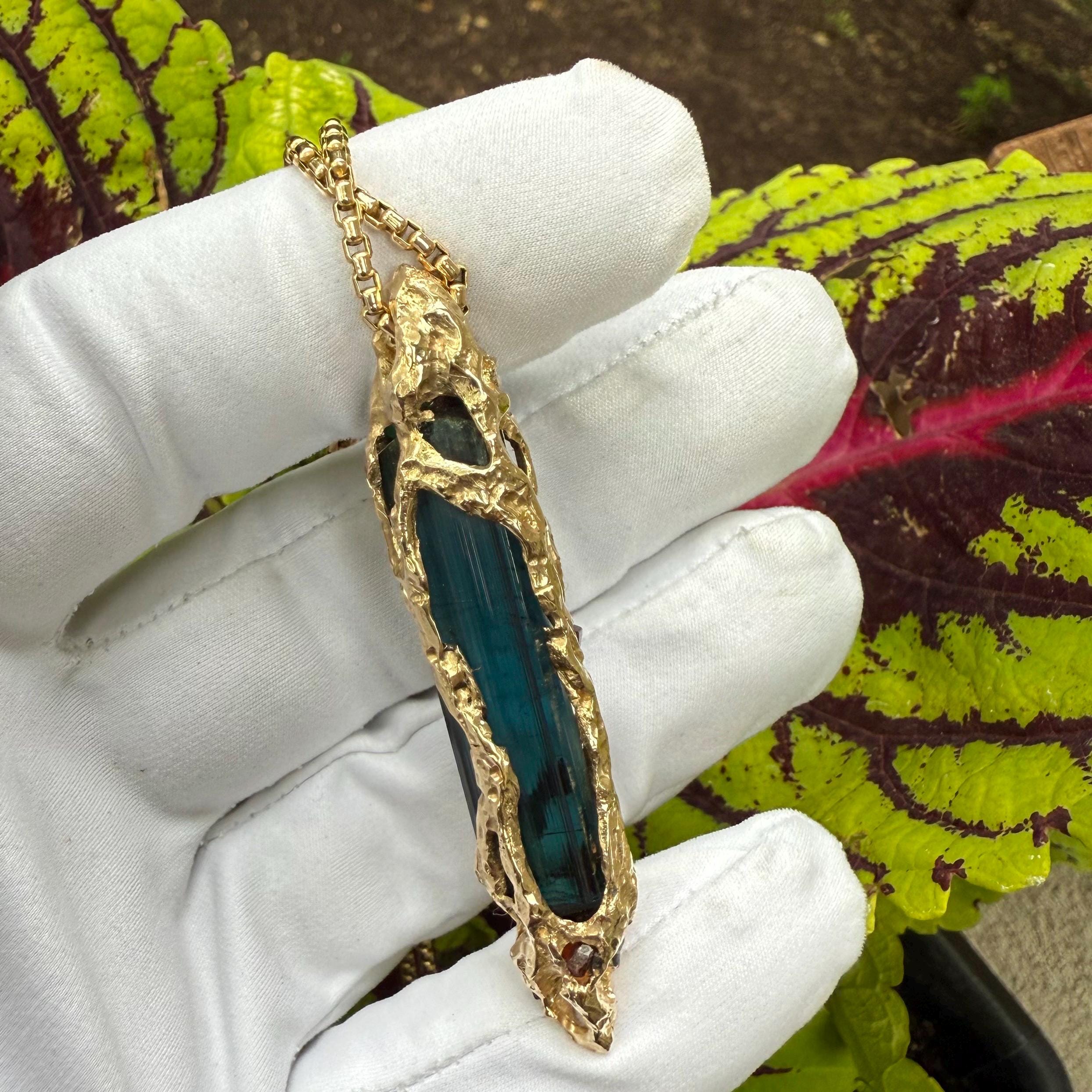 A one-of-a-kind masterpiece crafted from 14k gold, featuring an old stock, Indicolite Pederneira Tourmaline.