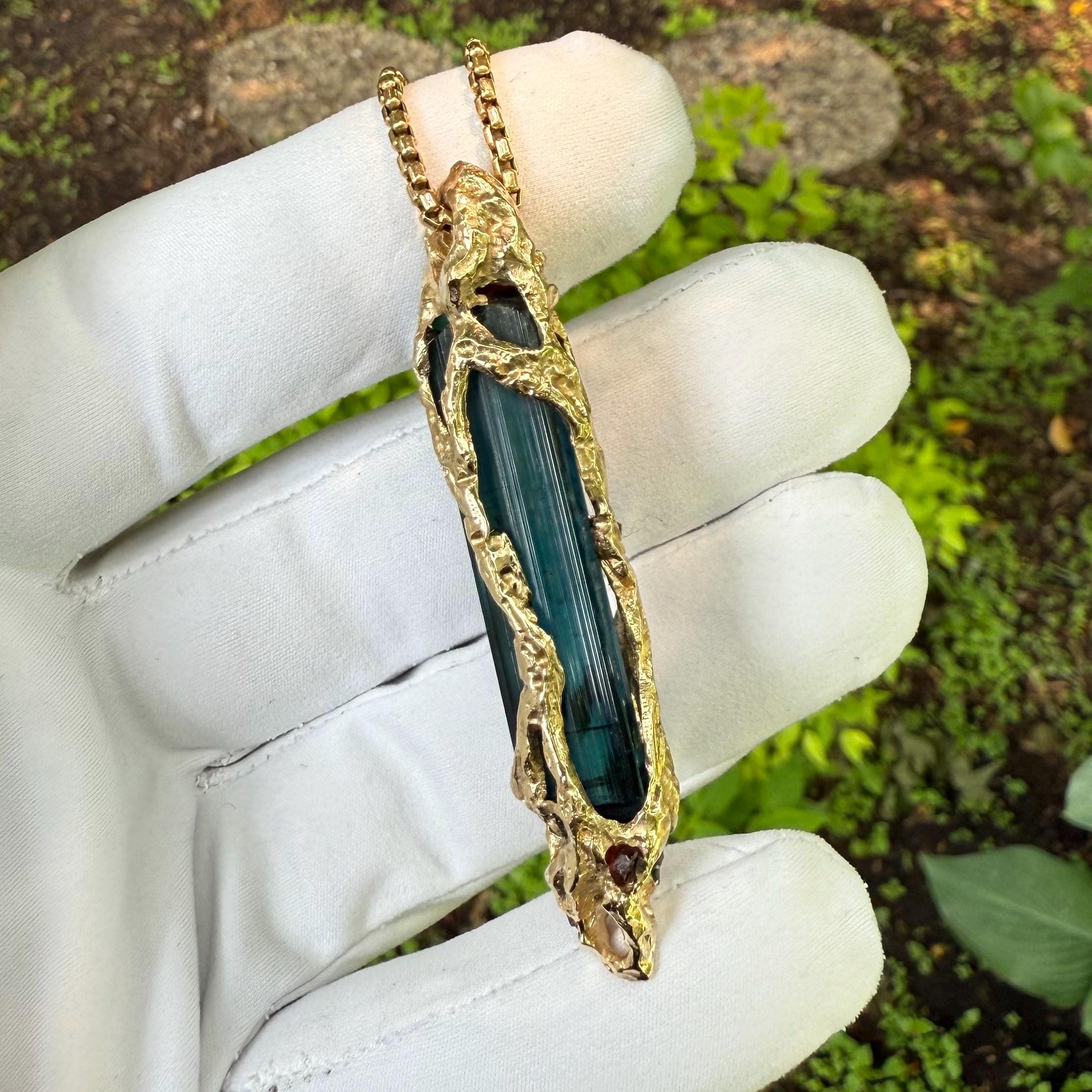 A one-of-a-kind masterpiece crafted from 14k gold, featuring an old stock, Indicolite Pederneira Tourmaline.
