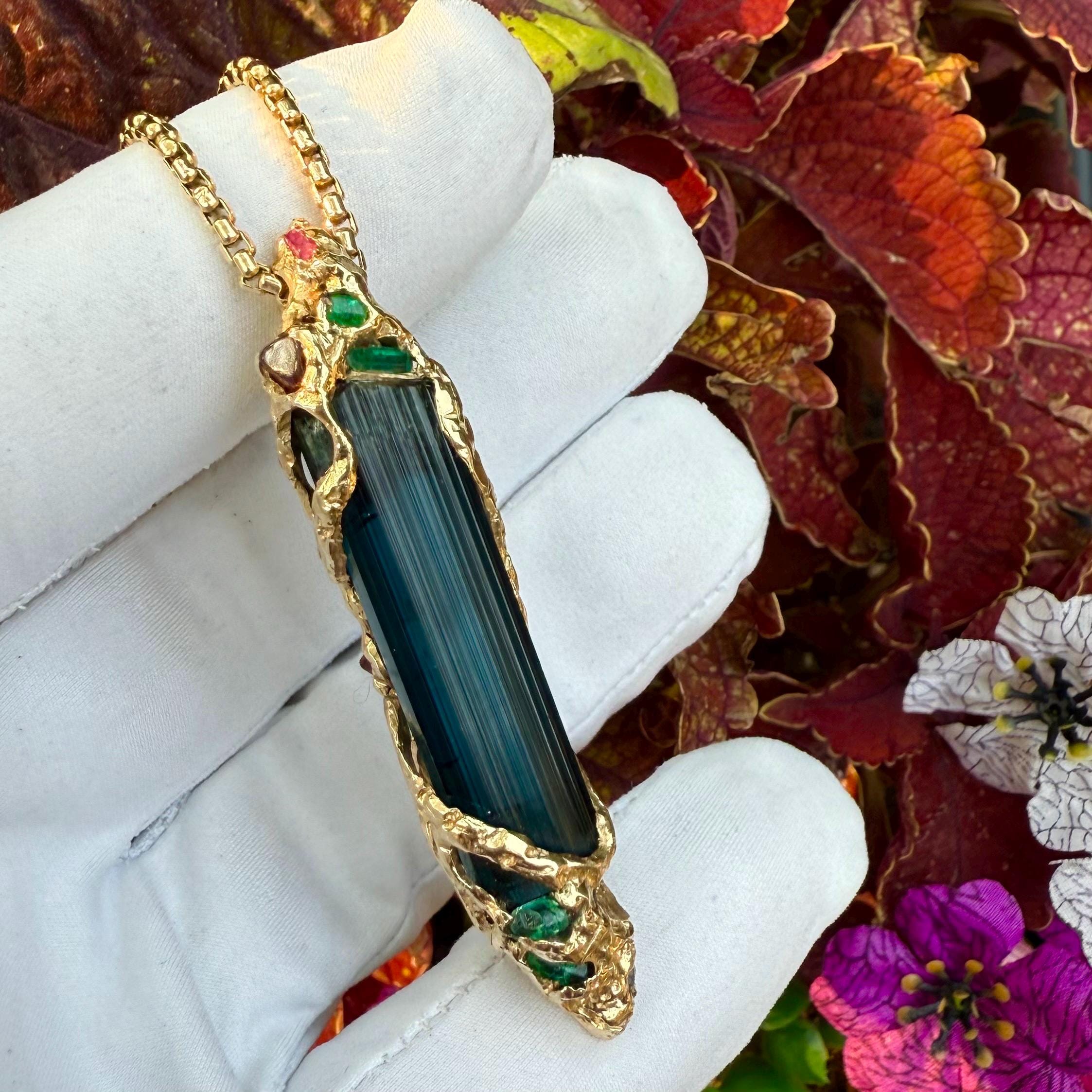 A one-of-a-kind masterpiece crafted from 14k gold, featuring an old stock, Indicolite Pederneira Tourmaline.
