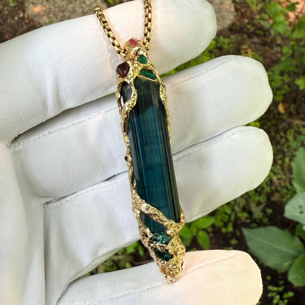 A one-of-a-kind masterpiece crafted from 14k gold, featuring an old stock, Indicolite Pederneira Tourmaline.